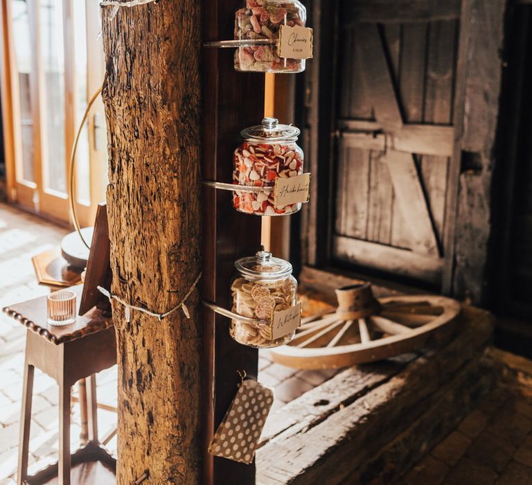 Barn wedding with sweetie jars for guests at Elmley Nature Reserve