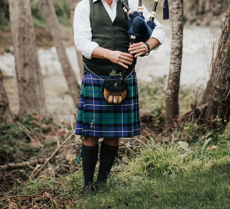 Bagpiper at Scottish highland wedding inspiration 