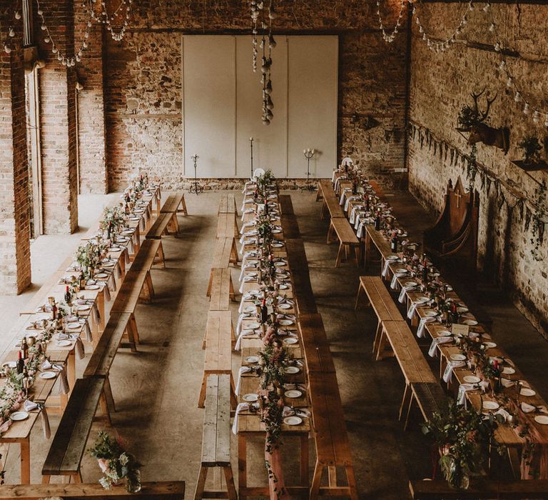 Long banquet tables for medieval wedding with flowers, thrones, goblets for medieval fantasy wedding 