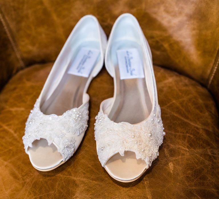 Lace and pearl embellished wedding shoes for lesbian wedding at Foxtail Barns venue 