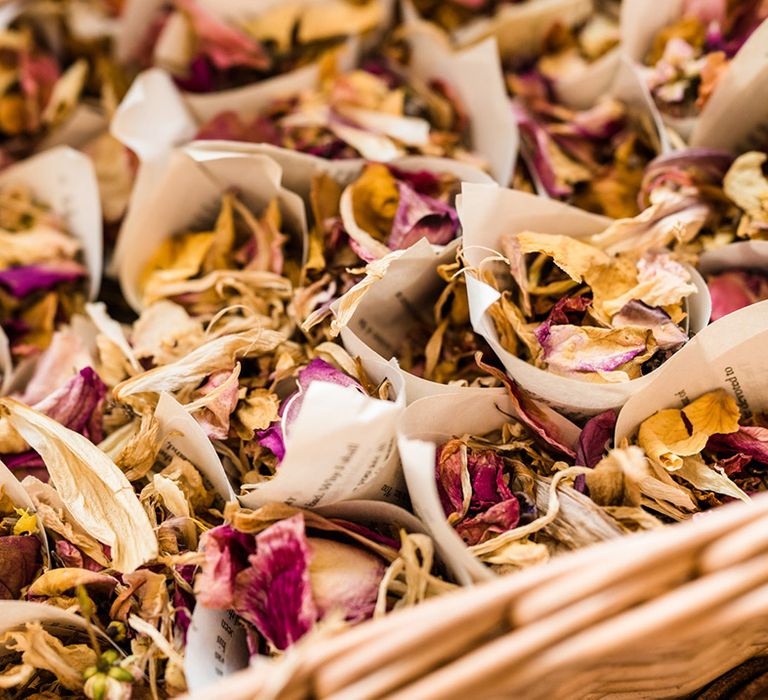 Dried flower autumnal wedding confetti in paper holders for wedding guests to throw