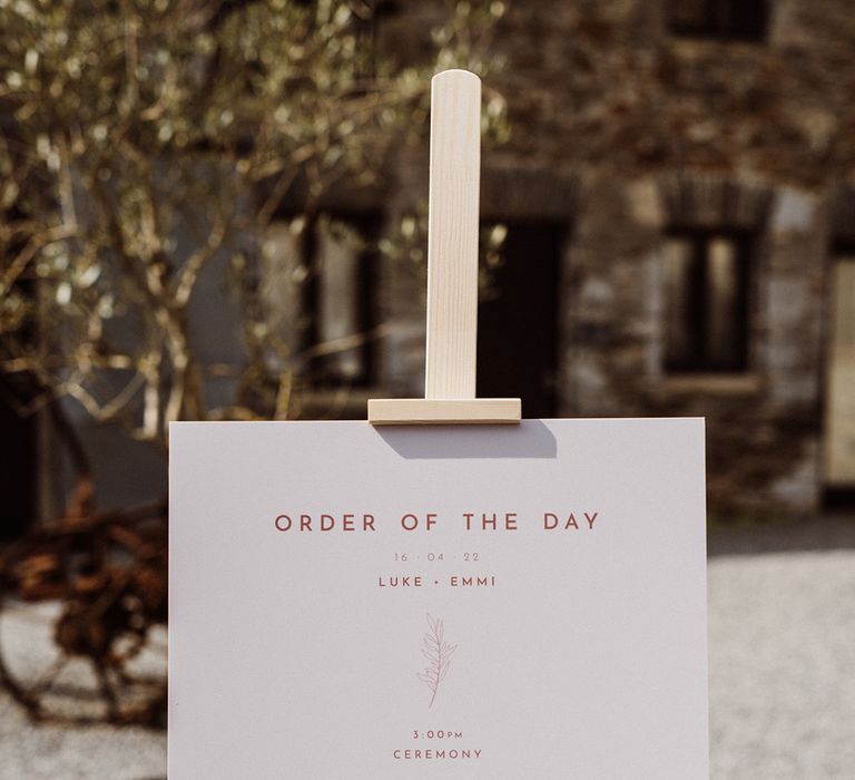 Pale pink order of the day wedding sign 