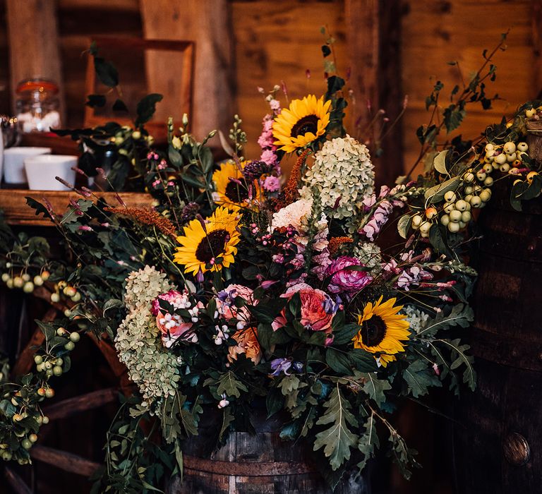 Bright wedding flowers with pink and white flowers with sunflowers and berries