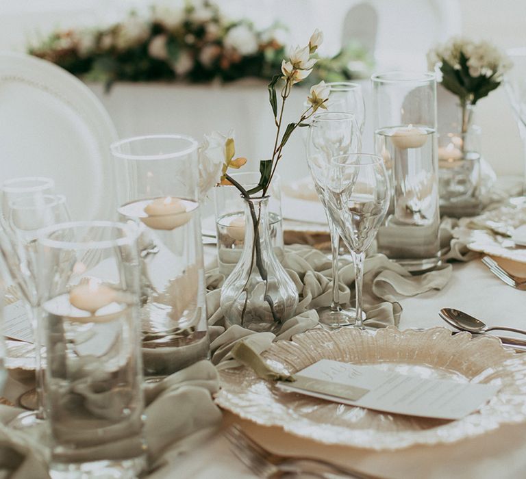 Classic and soft sage green and white wedding tablescape with gold details 