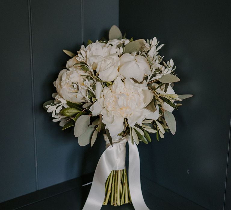 White flower wedding bouquet tied with white ribbon for a Tuscany-style Norfolk wedding 