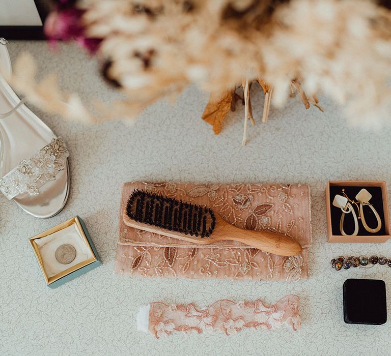 Bristle brush, pink garter, beaded purse, Rainbow Club beaded heels, white retro earrings, and beaded bracelet 