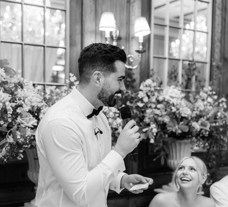 Groom reading out wedding speech for the wedding tradition 