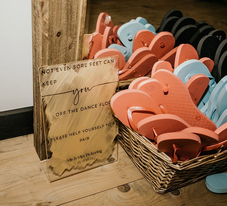 Flip flops in basket wedding favours for guests wanting to dance the night away 