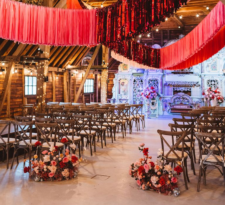 Hot pink and metallic red streamer decorations at Preston Court wedding venue for funky retro wedding 