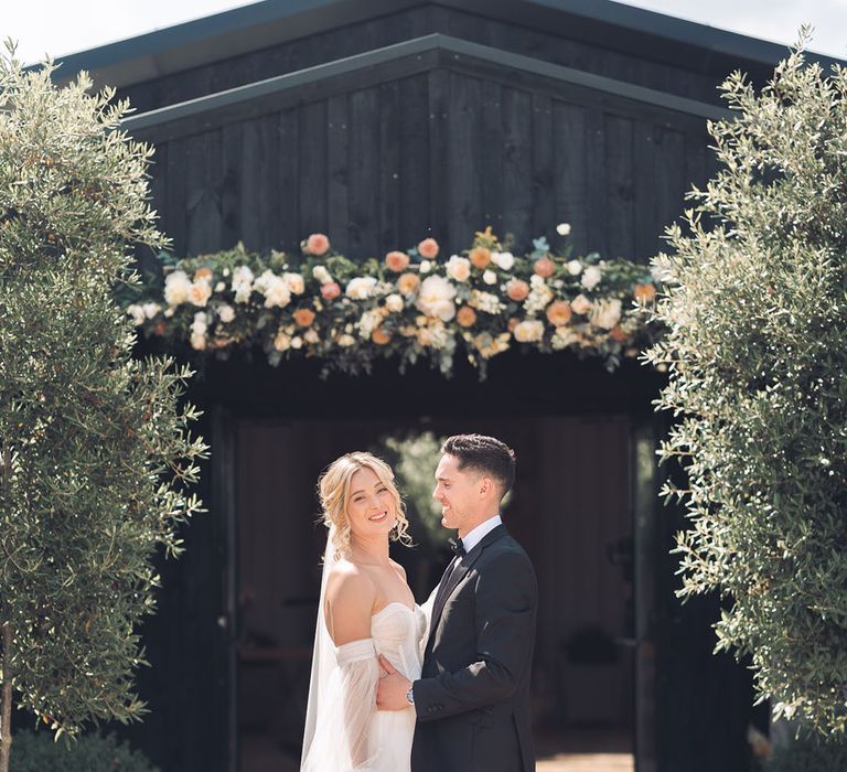 Blush pink and peach wedding flower entrance arrangement