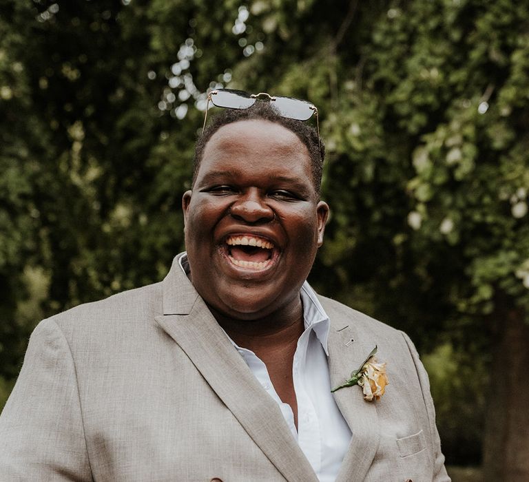 Wedding guest in grey double breasted suit jacket with microphone 