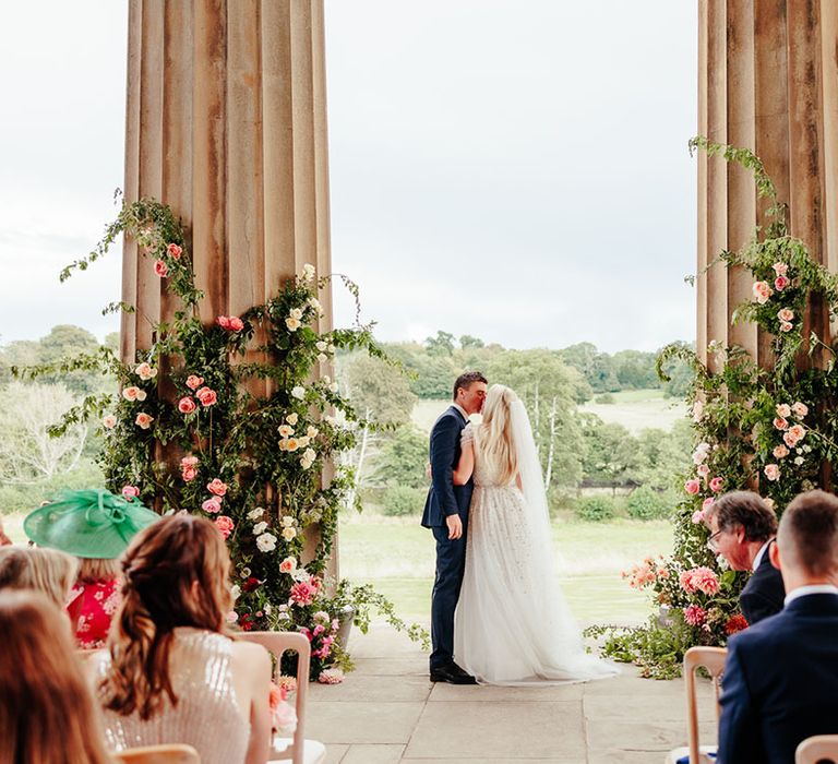 The Grange in Hampshire wedding venue with pink wedding flower column arrangements 