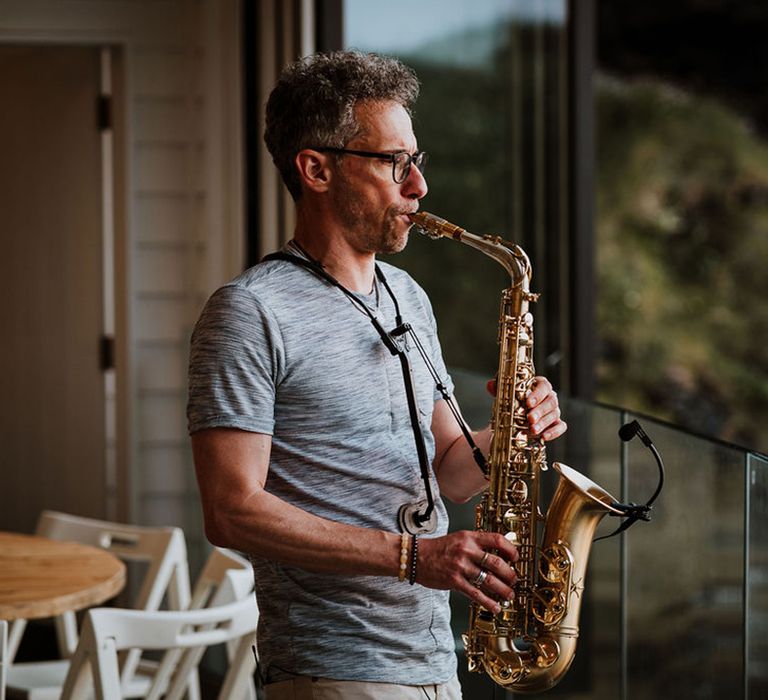 Wedding entertainment saxophone player for the outdoor wedding reception 