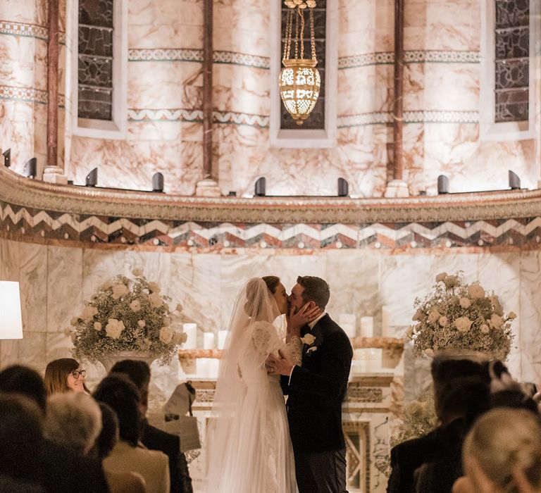 First kiss for the bride and groom at their wedding in London 