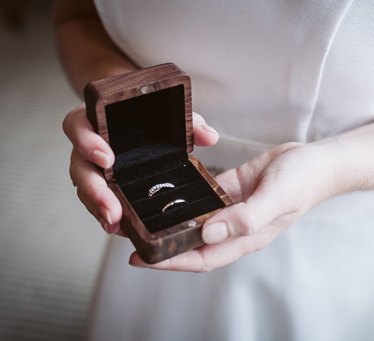 Wooden ring box with wedding bands for traditional same sex wedding ceremony 