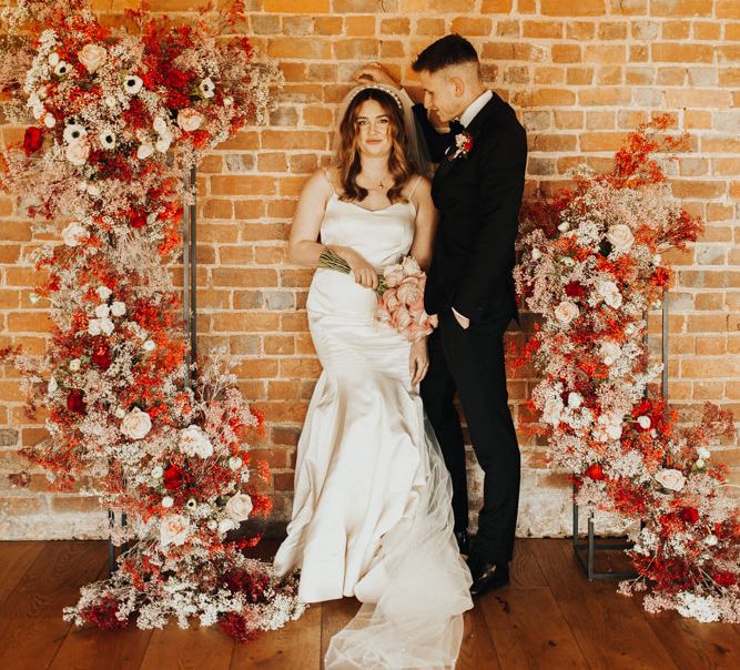 Red spray-painted gypsophila wedding installation