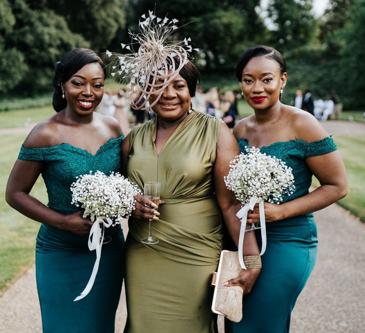 Mother of the bride and bridesmaids in green dresses 