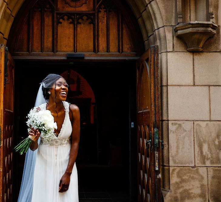 Beautiful bride in a Jenny Packham wedding dress with birdcage veil