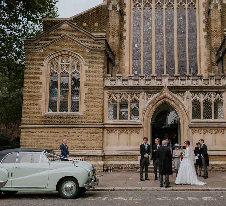 Wedding guests waiting at London Church