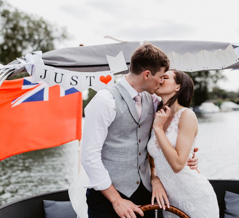 Bride & groom kiss on wedding day 