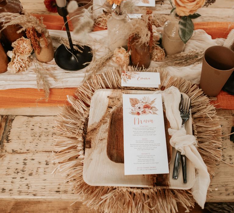 Autumnal table decoration with wooden plates