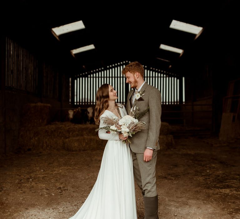 The happy couple in the groom's family barn