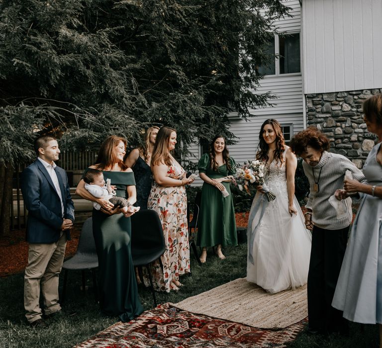 Bride walks down the aisle outdoors in New York elopement