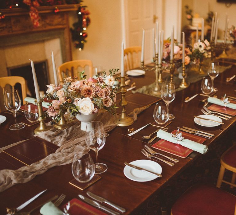 Elegant tablescape with stag napkin rings and gold candlesticks 