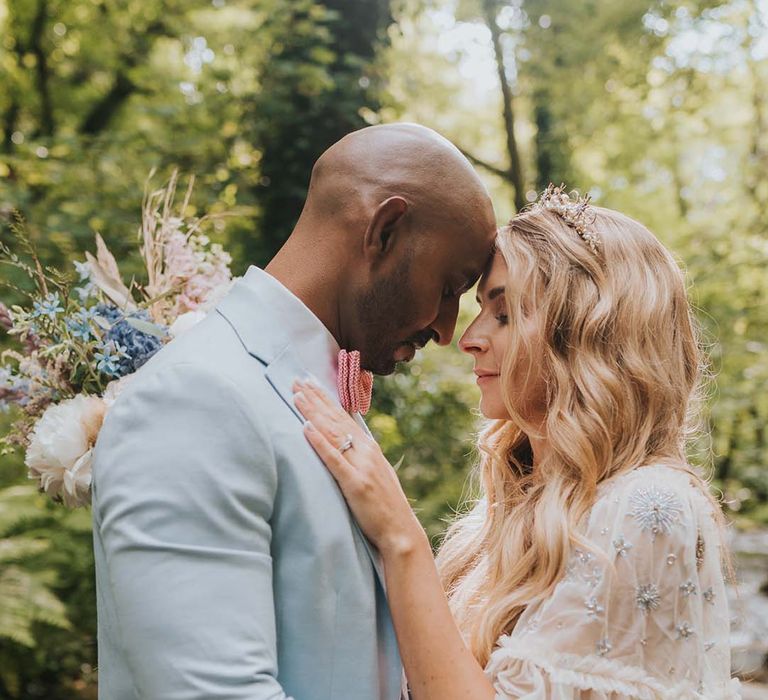 Bride wears her blonde hair in loose waves on her wedding day