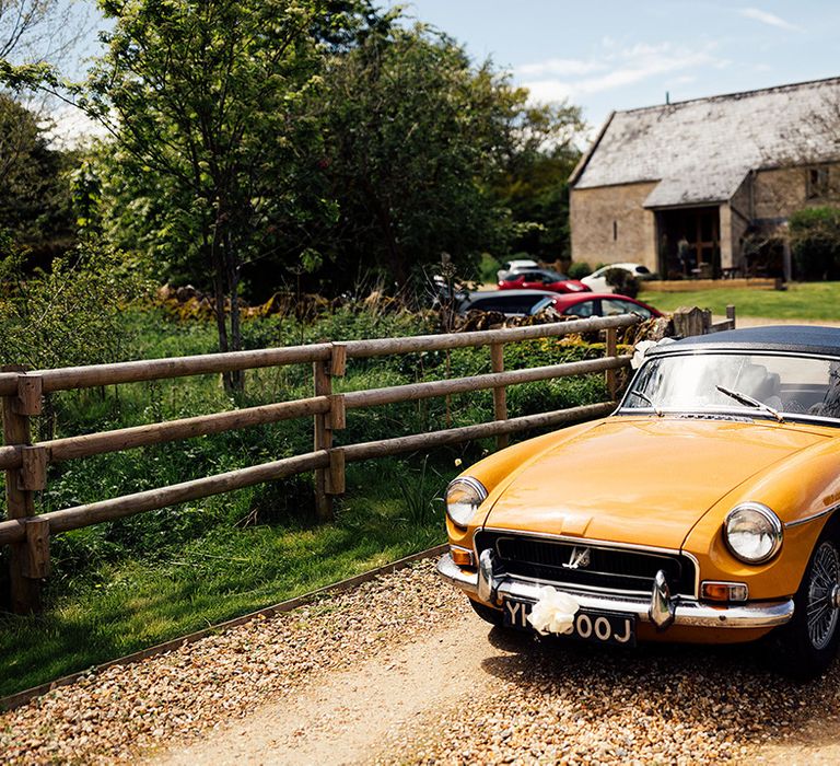 Vintage wedding car in yellow