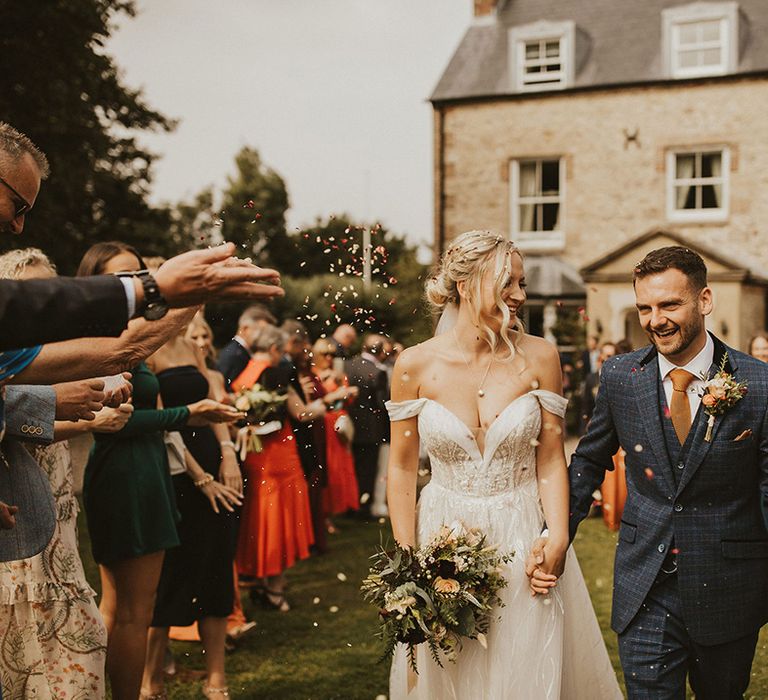 Confetti moment for bride and groom at East Afton Farmhouse 