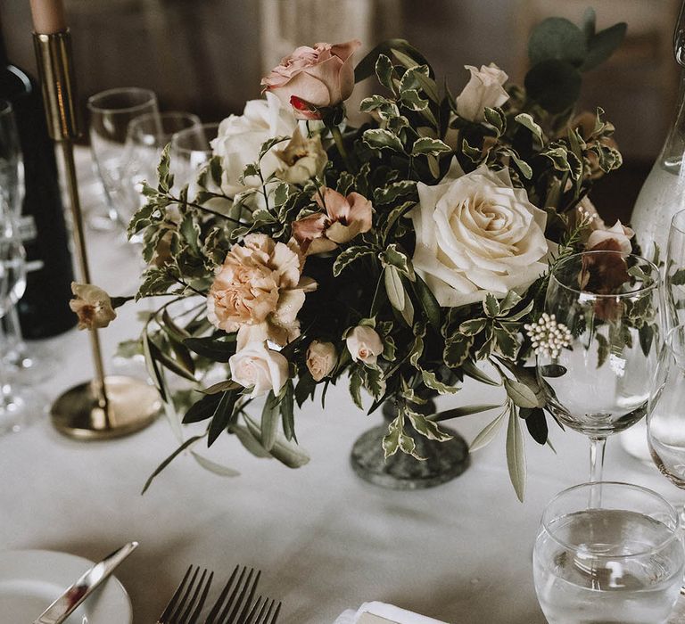 Wedding flower table centrepieces at classic wedding