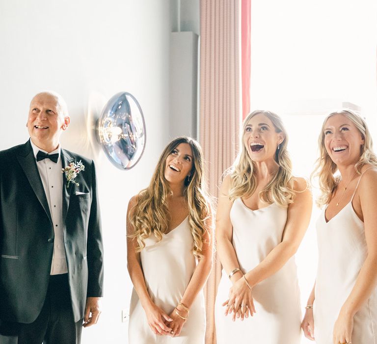 Bridesmaids in neutral dresses 