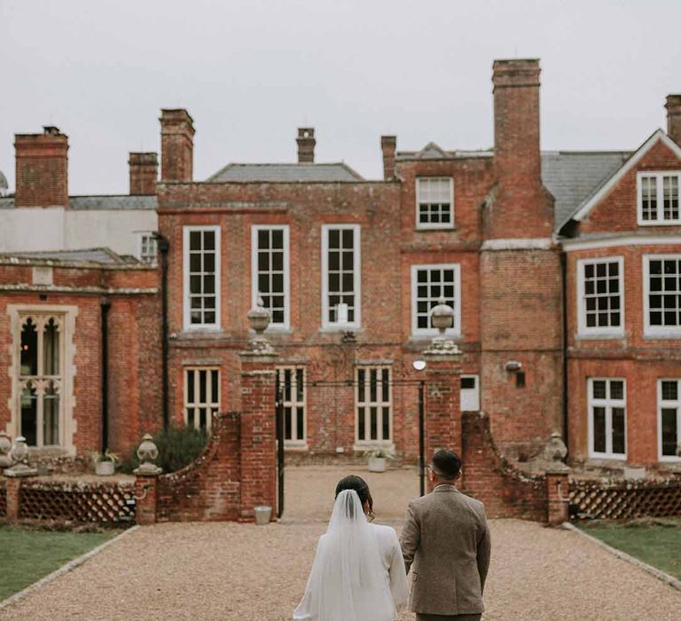 Bride and groom walking at Leatherhead Registry Office 