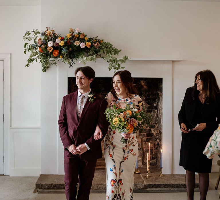 Bride and groom walk back down the aisle as husband and wife 