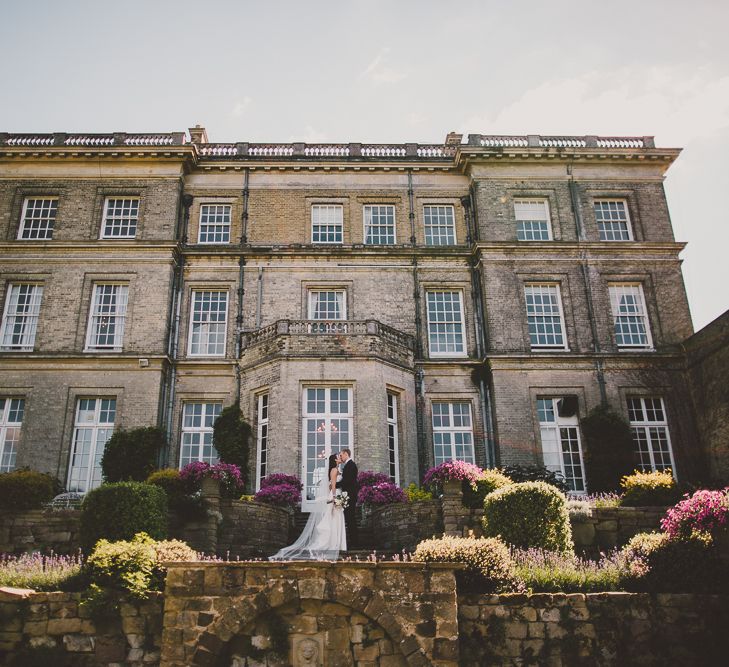 Couple standing in front of Hedsor House