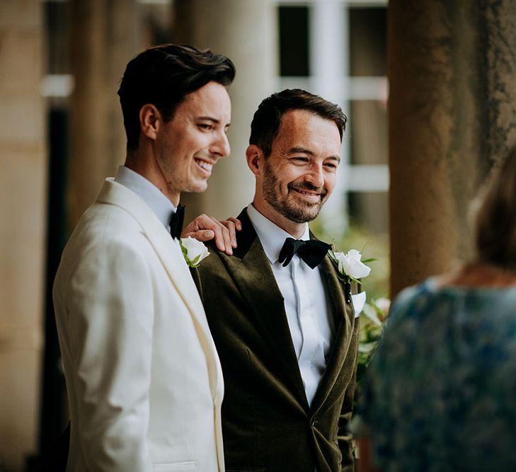 Grooms wearing black tie during wedding ceremony outdoors at Birdsall House 