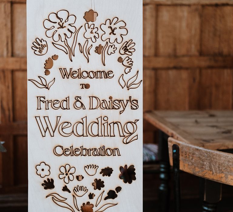 DIY laser cut wedding sign on wooden board and easel 