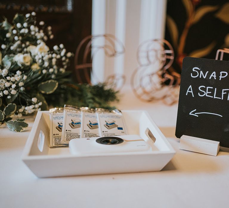 Wedding guest book full of polaroid cameras 