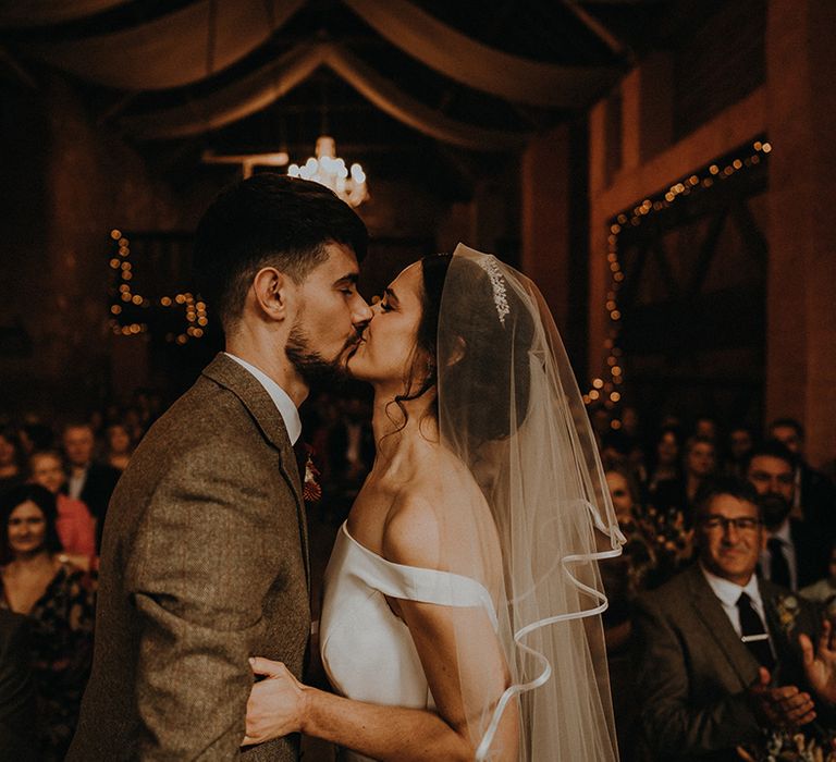 The bride and groom share their first kiss as husband and wife 