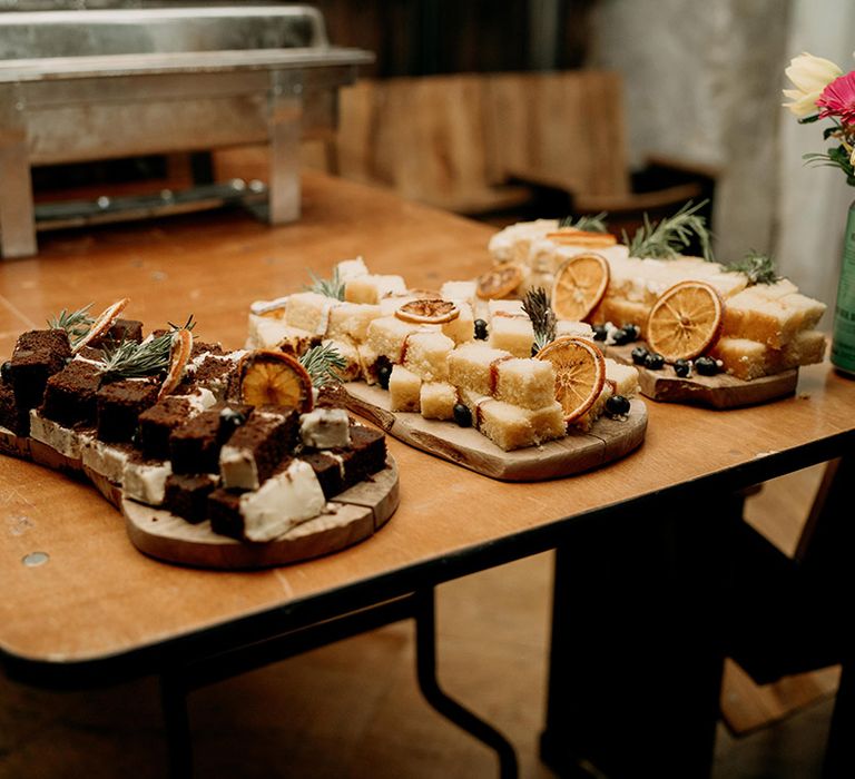 Wooden platters of food to serve the wedding guests 