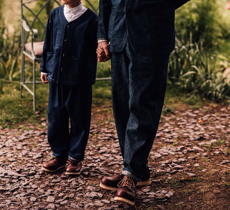 Groom and son in matching double denim suits for the relaxed outdoor wedding 