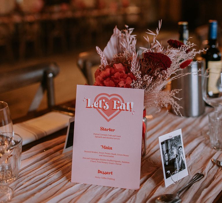 Intimate wedding in London at The Bedford with a pink and red wedding menu card with heart design 