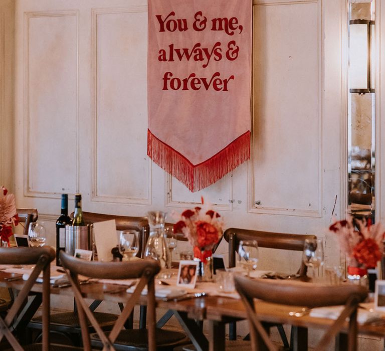 Red and pink retro wedding banner signage at the wedding breakfast at The Bedford wedding venue 