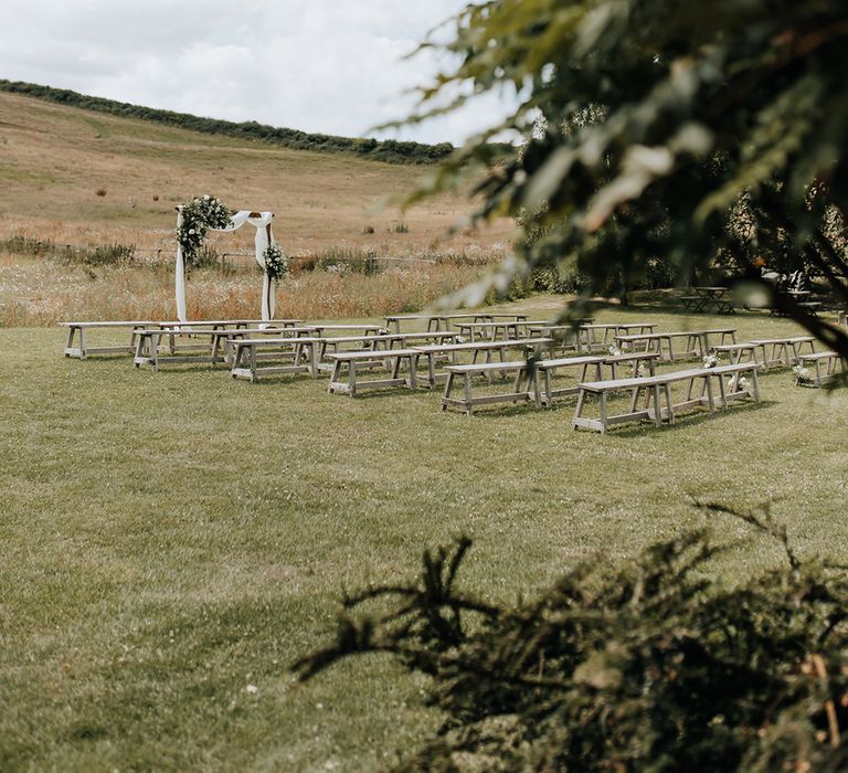 White drapery altar decoration for outdoor ceremony at Lyde Court 