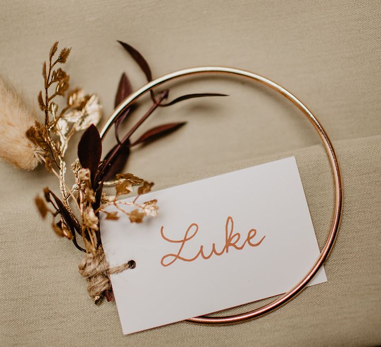 Handmade wedding place name card with gold leaves 