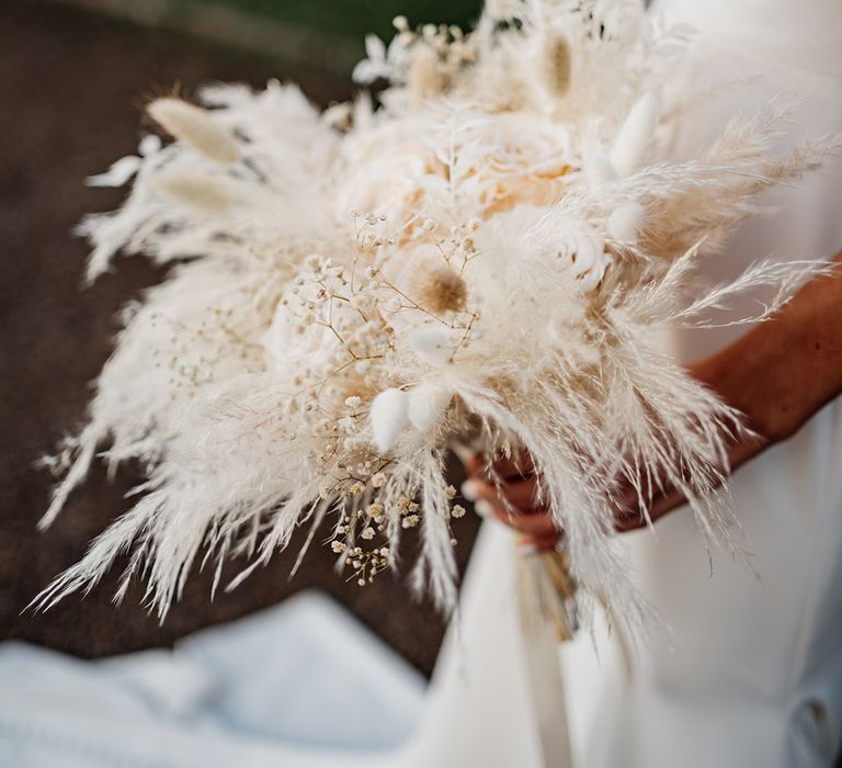 All white dried wedding flower bouquet with bunny grass for winter wedding 