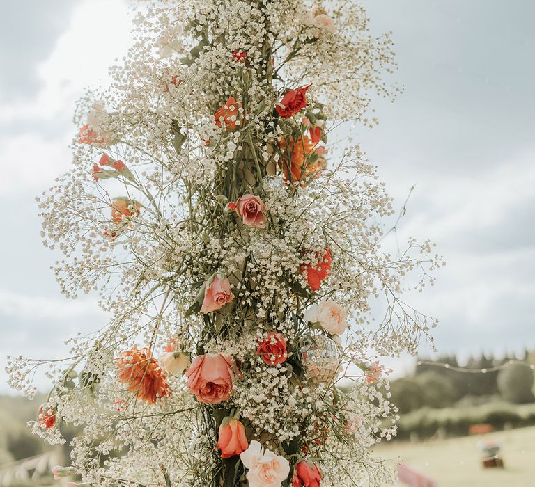 Gypsophila and red rose and carnation wedding flower arch 