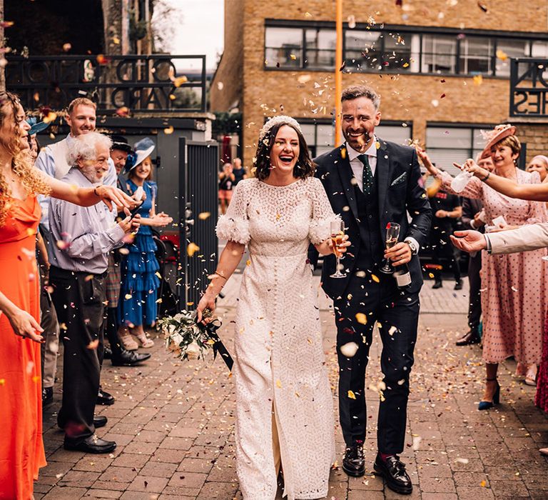 Confetti entrance for the bride and groom as they enter their wedding reception 