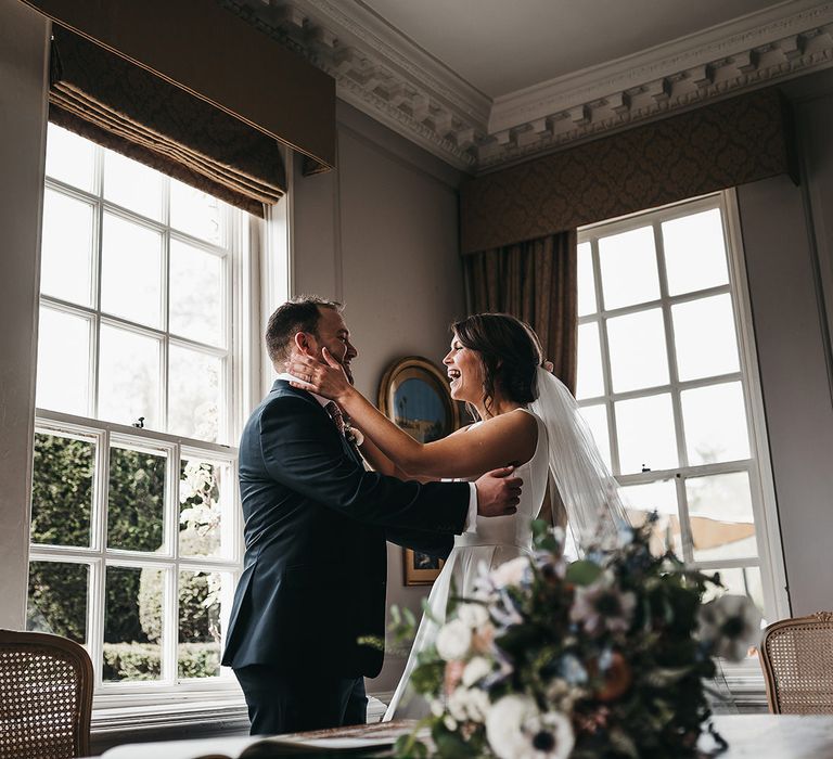 Bride and groom steal a moment at Brinsop Court wedding